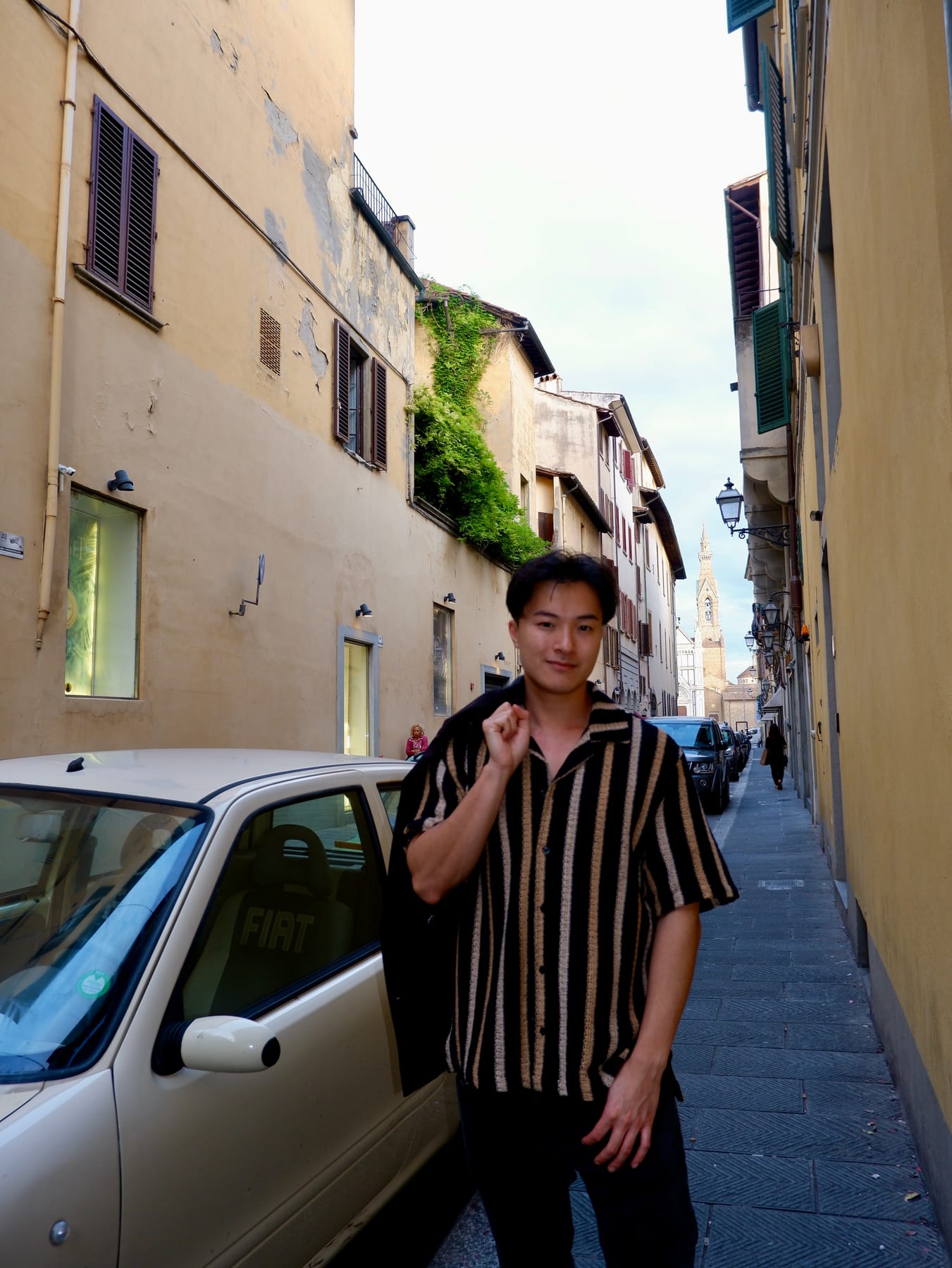 John Wen on a street in Florence